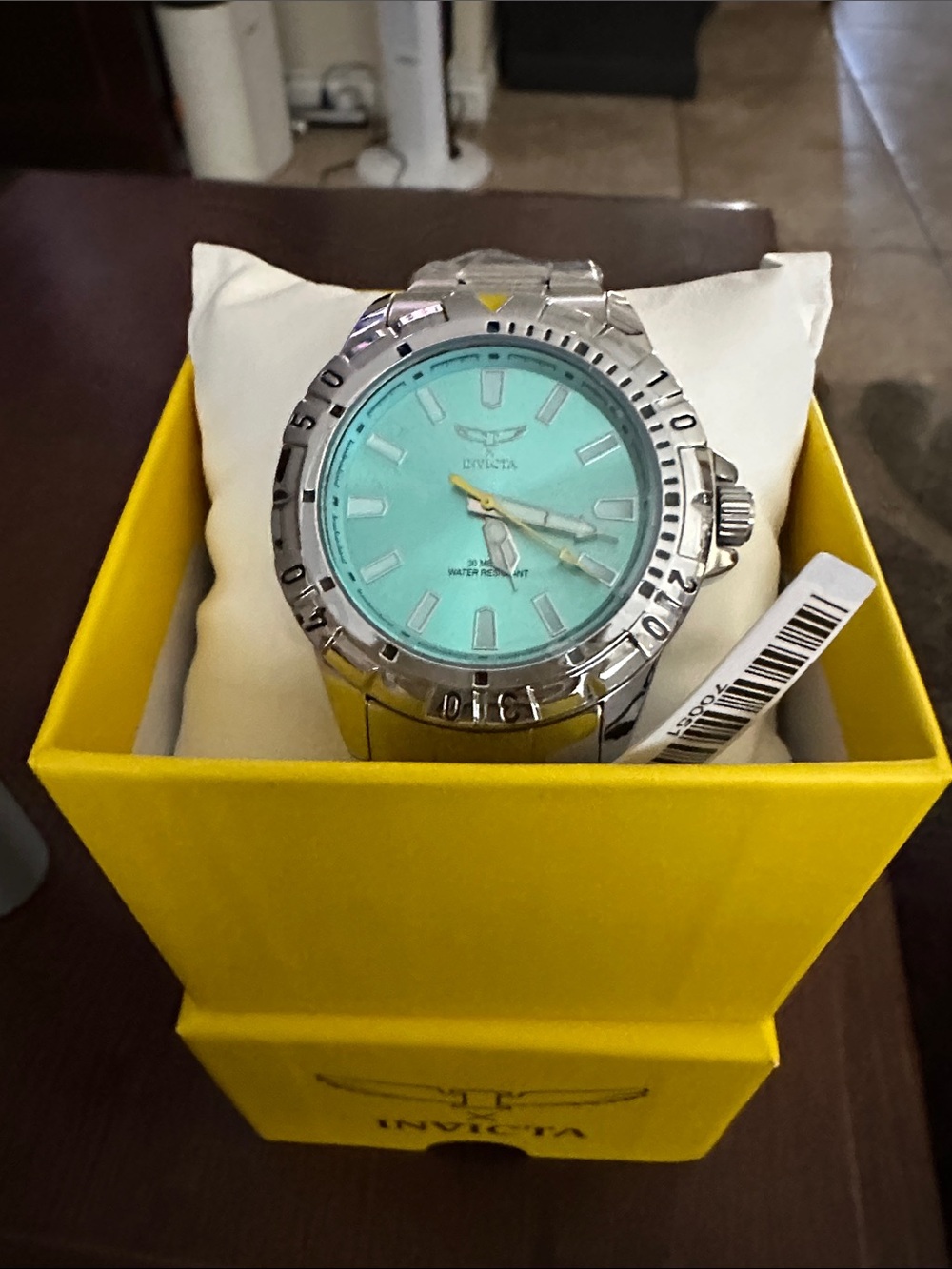 Invicta Silver Watch with Turquoise Dial and Yellow Accent